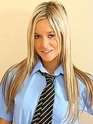 Blonde teen strips out of her college uniform, complete with cotton panties and black stockings (Carman K)