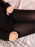 Red haired beauty in black opaque pantyhose and sexy boots