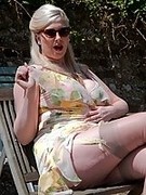 In her frothy frock, sheer full fashion nylons and spiky heels busty MILF is ready for hot sex.