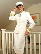 White naval uniform with black stockings and high heels