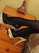 Sensational long legs in black stockings and high heels